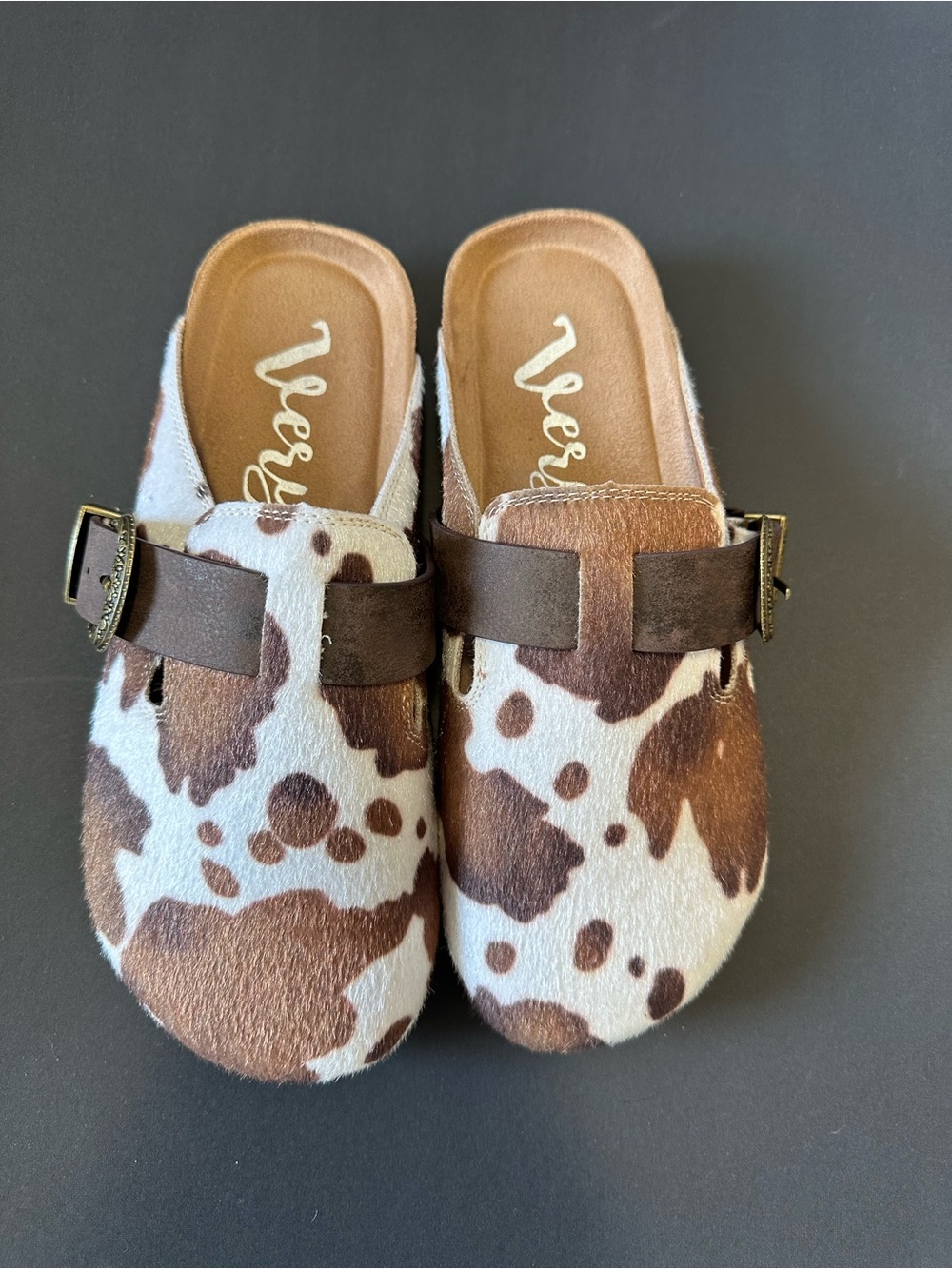 Cow print clogs